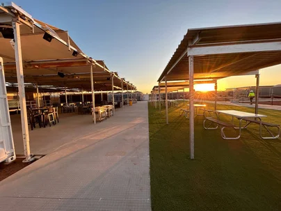 Undercover walkways and outdoor seating at sunset